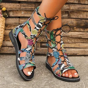 Detailed view of women's colorful snakeskin print gladiator sandals with lace-up front