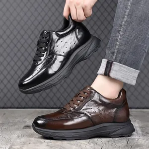 Luxe heren sneakers van echt leer in zwart en bruin in de trendy dad shoe-stijl