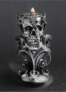 Detailed view of a gothic skull backflow incense burner with smoke cascading down