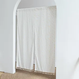 Minimalist white split door curtain featuring yellow polka dots and elegant tassel trim