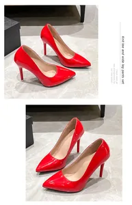 Detailed view of elegant red patent leather stiletto heels with pointed toe design