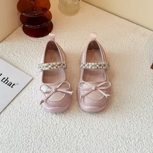Pink Mary Jane princess shoes for girls featuring a cute bow and rhinestone strap