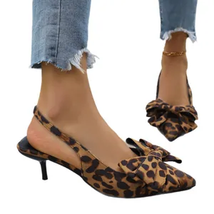 Pointed toe leopard print slingback pumps with elegant bow detail and kitten heels