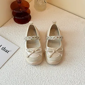 Elegant beige girl's princess shoes with bow and pearl rhinestone strap accents