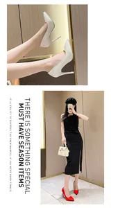 Macro view of elegant patent leather high heels and a full-body fashion look