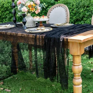Elegant black lace table runner with intricate floral patterns for wedding decor