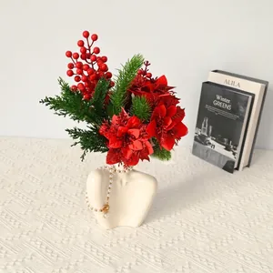 Artificial Christmas flower bouquet with red poinsettia and berries for holiday decor