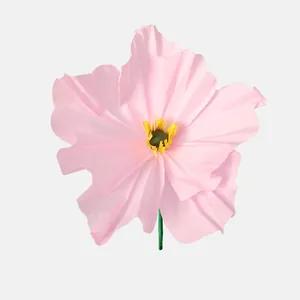 Detailed close-up of a handmade pink crepe paper poppy flower for DIY home decor