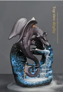 Detailed macro view of a ceramic dragon backflow incense burner with blue glaze finish