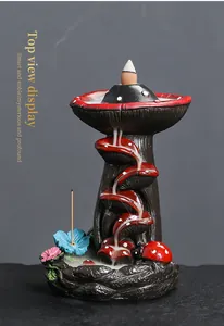 Detailed macro view showing smoke waterfall effect on mushroom backflow incense burner.