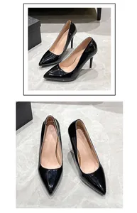 Detailed view of elegant black patent leather pointed toe stiletto high heel pumps for banquet