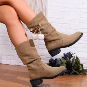 Stylish tan suede mid-calf boots for women featuring a cute pom-pom bow and chunky heel