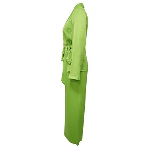 Side profile of a vibrant lime green long-sleeve blazer and wide-leg pants set for women
