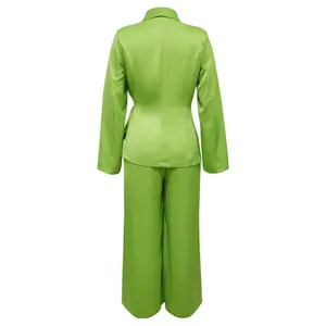 Detailed back view of a lime green two-piece suit with blazer top and wide-leg pants