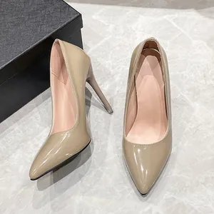 Elegant nude patent leather pointed-toe stiletto pumps for women's party or office wear.