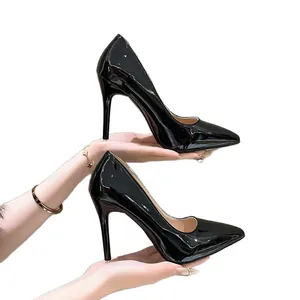 Elegant black patent leather pointed-toe stiletto pumps for professional and formal wear.