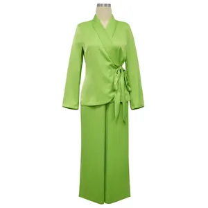 Front view of lime green wrap top and wide-leg pants set on professional mannequin