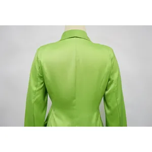 Back view of a lime green women's tailored blazer showing seam details and fabric texture