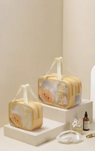 Two yellow PVC cosmetic bags with cute cartoon hamburger design on a display stand