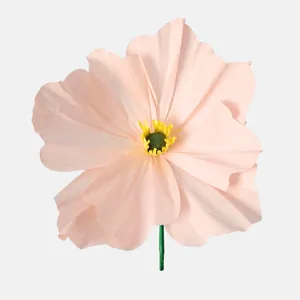 Detailed macro shot showing the delicate texture of a handmade pink crepe paper Poppy flower.