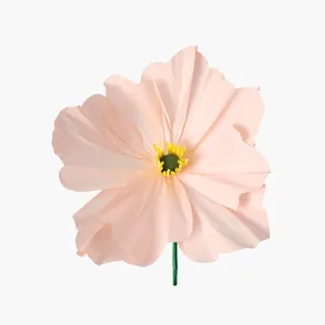 Detail view of a handmade crepe paper poppy in soft peach with wrinkled petal texture.