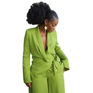 Elegant model wearing a lime green wrap blazer and matching wide-leg trousers suit set