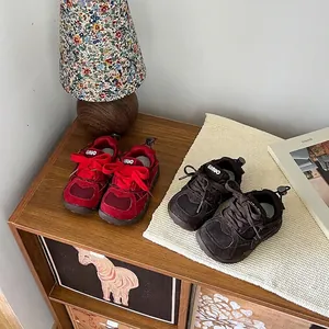 Breathable mesh children's sneakers in red and brown colors for kids