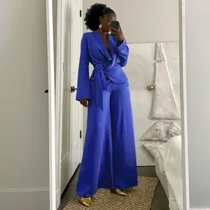 Full view of elegant royal blue wrap top with lapel and matching wide-leg trousers set