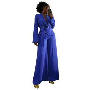 Full view of elegant royal blue women's two-piece set with wrap blazer and wide pants.