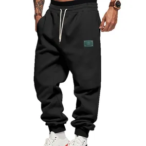 Men's American style loose fleece-lined sports joggers in black with patch detail