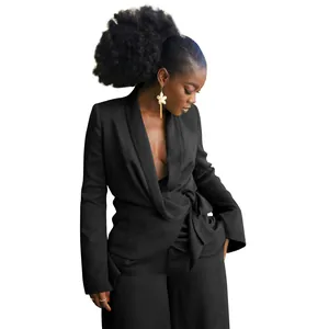 Detailed view of black wrap blazer and wide-leg trousers set with tie waist detail