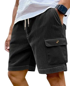 Detail view of men's black corduroy cargo shorts with drawstring waist and button pocket.