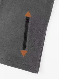 Close-up of vertical zipper pocket on grey polar fleece sweatshirt for men