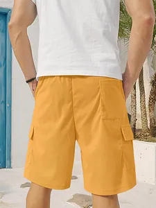 Rear view of men's mustard orange corduroy cargo shorts featuring functional back pockets