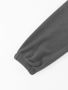 Close-up detail showing the elastic ribbed cuff of a warm grey polar fleece men's hoodie