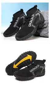 Detail view of black outdoor wading shoes with non-slip yellow arrow rubber outsoles