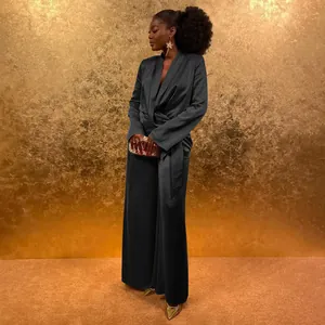 Elegant black satin wrap-style blazer with tie waist and matching wide-leg pants set