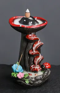 Close-up of a creative mushroom resin backflow incense burner featuring a flowing smoke effect