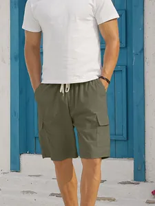 Detail shot of men's olive green corduroy cargo shorts with drawstring and side pockets