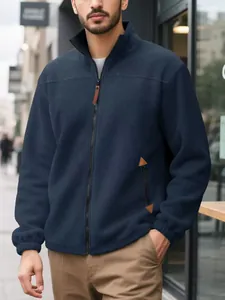 Close-up of men's navy blue fleece zip-up jacket showing fabric texture on a model