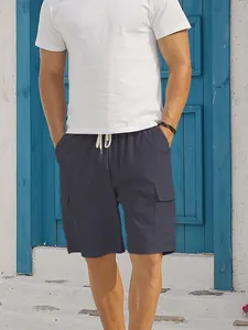 Men's dark grey corduroy cargo shorts with drawstring and large flap pockets detail
