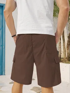 Back view of men's brown corduroy cargo shorts featuring functional side pockets and loose fit