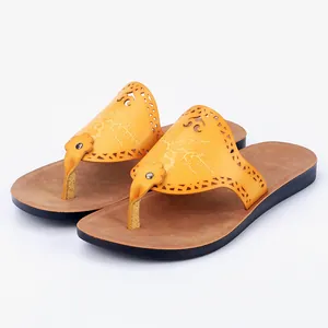 Women's yellow PU leather thong sandals with floral laser-cut design for summer beach