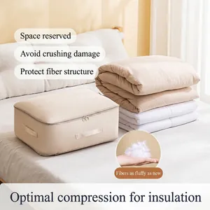 Large capacity beige quilt storage bag with handles for bedding and clothes organization.