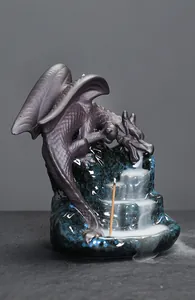 Detailed view of a ceramic dragon backflow incense burner with cascading smoke effect