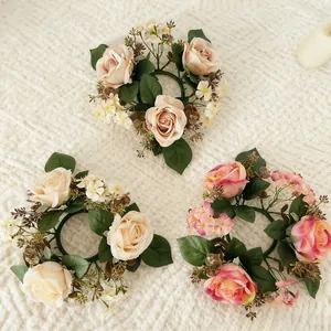 Set of three artificial rose candle rings and wild flower wreaths for home table decor