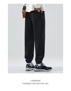 Back side view of black American style joggers sweatpants for men.