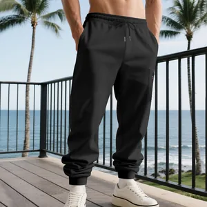 Detail of heavy black joggers for men with drawstring waist and cargo pocket