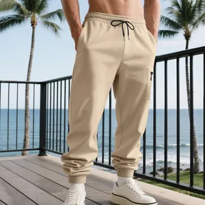 Men's heavy beige cargo joggers featuring drawstring waist and ribbed cuffs in beach scene