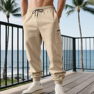 Detail view of men's beige heavy weight casual cargo jogger pants with elastic drawstring waist
